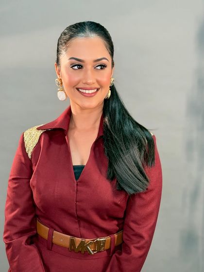 A beautiful portrait of Neetha Ashok. Her smile is radiant, and her makeup is perfectly polished for the awards night.