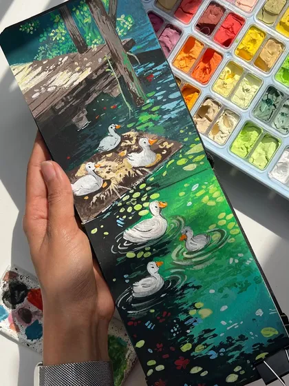A whimsical gouache painting of a family of ducks swimming in a line. I focused on the little details, like the ripples in the water and the soft light on their feathers, to create a charming, storybook scene.