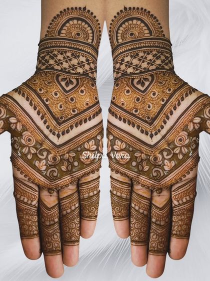 A symmetrical chevron-style design with heart motifs, creating a modern and geometric look.