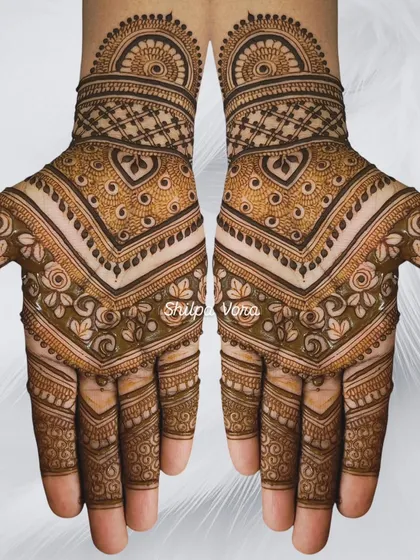 A symmetrical chevron-style design with heart motifs, creating a modern and geometric look.