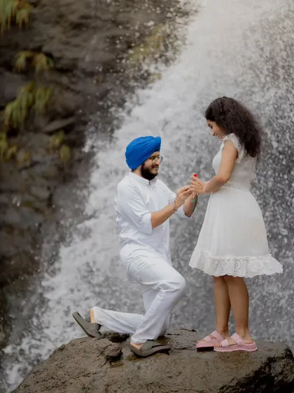 A surprise proposal during a pre-wedding shoot against the stunning backdrop of a waterfall. I help couples find unique locations to capture these once-in-a-lifetime moments, turning their love story into a visual adventure.