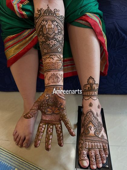 This design combines story elements on the arm with matching traditional patterns on the hand and foot.