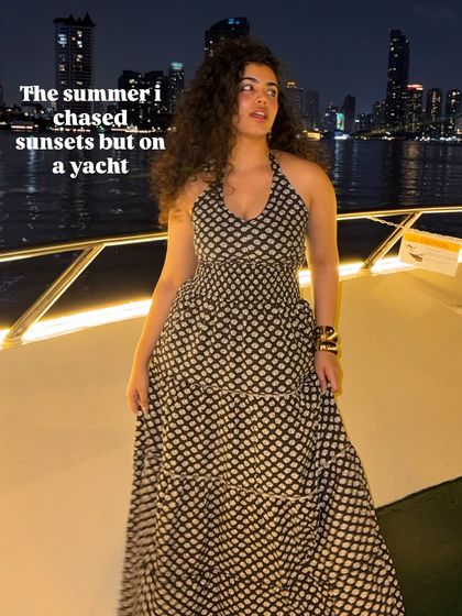The summer I chased sunsets, but on a yacht. A flowy maxi dress is a must-pack for any vacation. This printed halter dress is elegant and comfortable, perfect for a special evening.