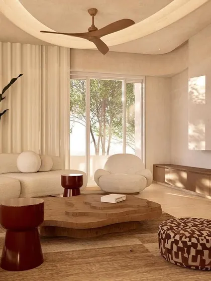 This living room from our Kumo House project embodies the Japandi style. We used a palette of neutral tones, curved furniture, and abundant natural light to create a 4500 sq ft family home that feels both expansive and intimately calm.
