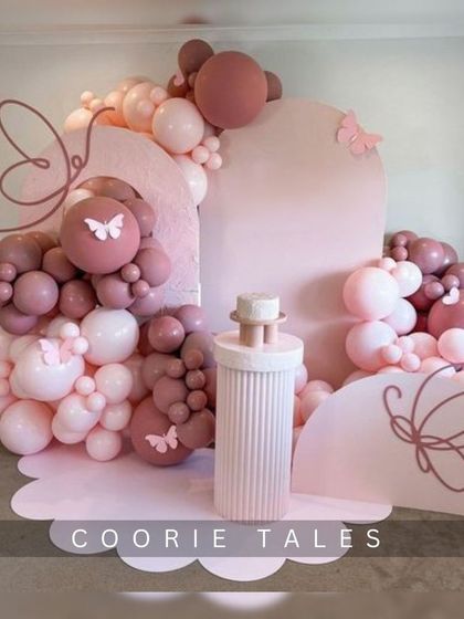 A soft and dreamy butterfly theme in shades of dusty rose and pink. This aesthetic design uses clean lines, arched backdrops, and delicate butterfly accents to create a modern and elegant party atmosphere.