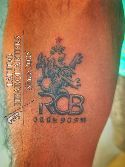 For the cricket fans. A tattoo of the Royal Challengers Bangalore (RCB) logo, complete with a special date.