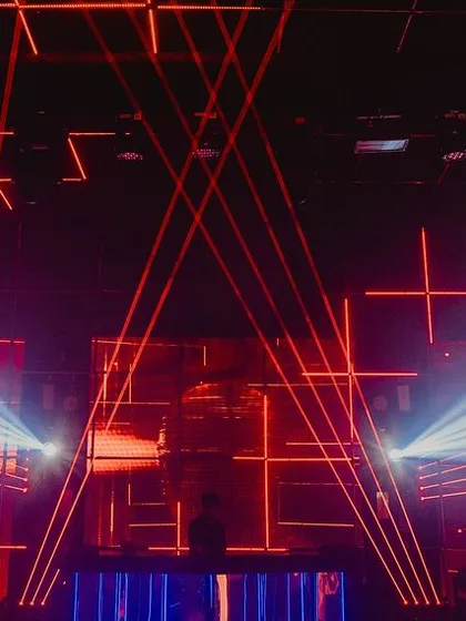 We love pushing creative boundaries, and for this 25th birthday, we designed a 'Boiler Room' inspired techno party. An intricate setup of laser lights, strobes, and a central DJ cage created an authentic, high-energy club experience that was both edgy and spectacular.