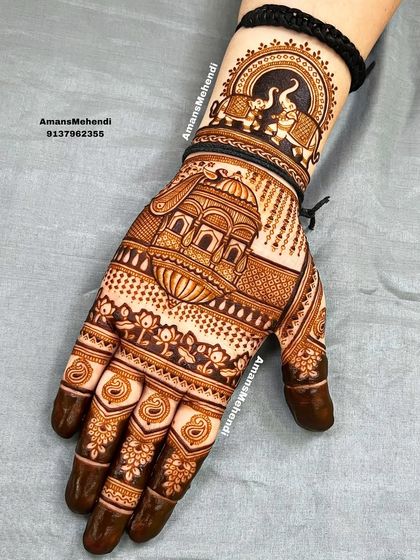 A majestic design featuring a grand palace on the palm. The wrist is adorned with a circular motif of two elephants, creating a royal and traditional feel.