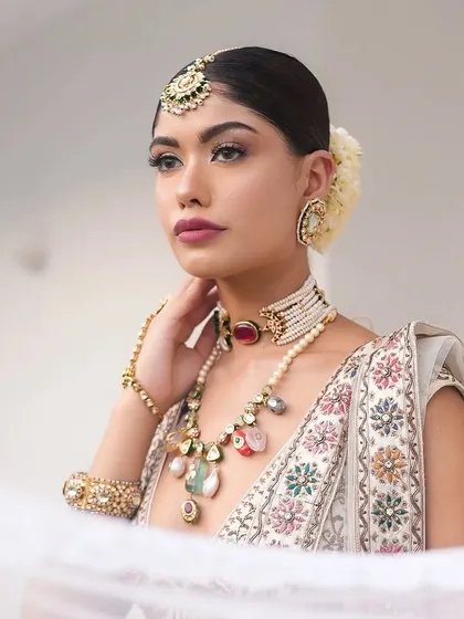 A beautiful close-up through a sheer veil. This shot captures the romance and delicacy of the "Laila" bridal look I curated.