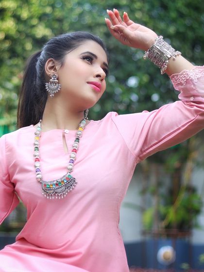 You can easily dress up a simple silk kurta with the right accessories. Here, I've added a bold, oxidized silver necklace to give this pink kurta a more bohemian and festive feel.