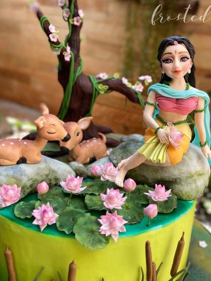 This Shakuntala-themed cake won third place at Cakeology 2022. I loved creating this serene scene with the hand-sculpted figurine, deer, and delicate lotus flowers.