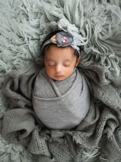And here is the other twin from the same session. Notice the slightly different wrap and headband, giving her a unique portrait while maintaining a cohesive look with her sibling's photo.