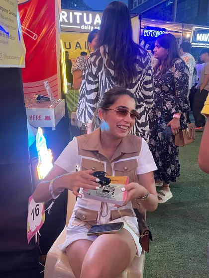 A happy customer enjoying her treats at our stall. I love seeing you all enjoy my food.