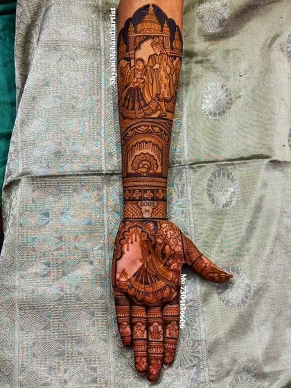 The same design as above, shown straight-on to highlight the full composition from fingers to elbow.