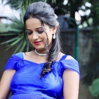 A close-up of the off-shoulder neckline on our royal blue maternity gown. The soft fabric and elegant design ensure you look and feel your best.