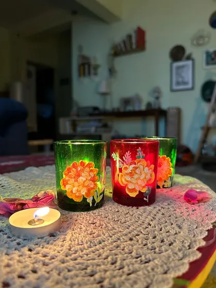 My mom painted these beautiful floral candle holders on tinted glass for the festive season.