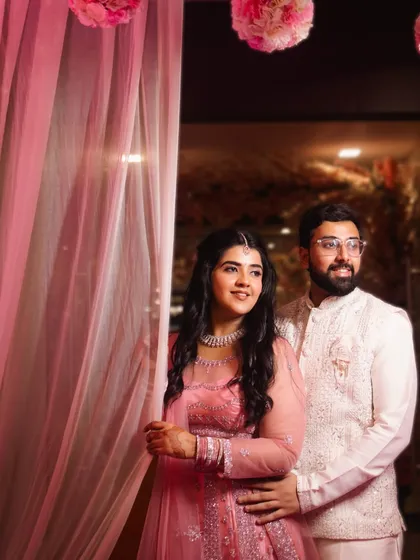 A sweet and happy portrait of the couple. Their genuine smiles and relaxed posture show their comfort with each other, making for a beautiful and authentic image.