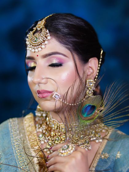 A unique bridal look incorporating a peacock feather, showing how we encourage creative twists on traditional styles.