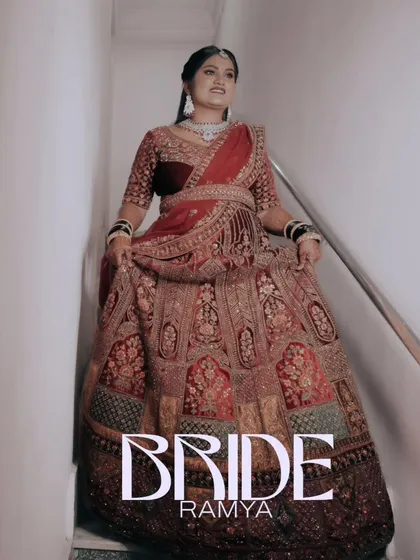 A full-length portrait of the bride in her magnificent reception lehenga. This shot showcases the grandeur and intricate details of her outfit.