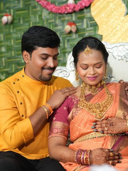 A heartwarming moment between the parents-to-be. Our client Varsha looks radiant in a full antique temple jewellery set for her baby shower ceremony.