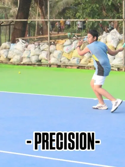 Precision is key in tennis. This player demonstrates excellent form and focus during a forehand drill, showcasing the kind of technical skill we develop in our training sessions.