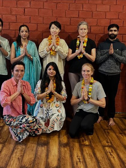 A beautiful moment from one of our YTTC batches. Adorned with marigold garlands, our diverse group of students from different parts of the world comes together to learn, grow, and share the ancient wisdom of yoga.
