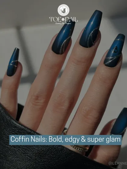 Embrace your edgy side with these bold, super glam coffin nails. This design features a deep blue matte base with intricate, shimmering silver line work, demonstrating our skill in creating dramatic and fashionable nail shapes.