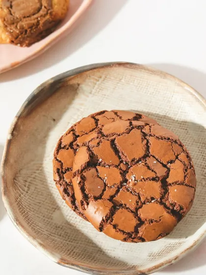 Sweet, soft, and irresistible. It’s a Brookie thing. This cookie has a beautiful cracked top, a signature of its fudgy texture.