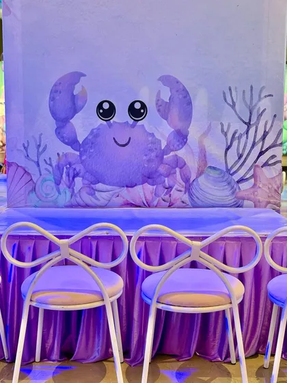 We set up dedicated activity stations for crayon making and tattoos, all themed with cute watercolor sea creatures to keep the little ones engaged and creative.