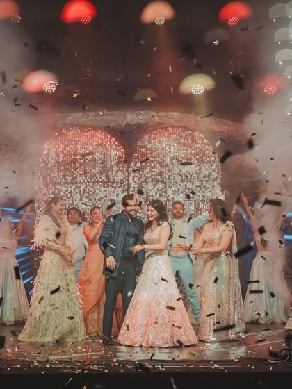 The grand finale of the groom's performance, complete with confetti and cold pyro, celebrating his heartfelt surprise for the bride.