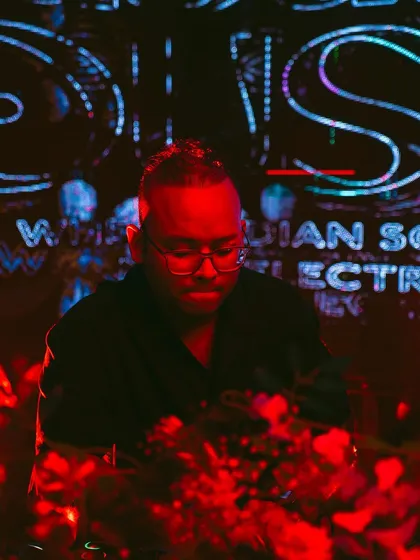 Focused on the mix under the red glow of the stage lights. Each Masala House set is a carefully curated selection of Indo-ethnic progressive and techno tracks.