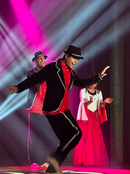 A classic, stylish performance perfect for a wedding reception. We blend timeless Bollywood charm with modern stage presence, complete with costumes like fedoras and jackets to fit your theme.