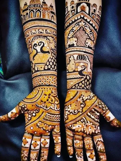 A majestic design featuring the Taj Mahal and other architectural elements on the arms. The palms are filled with intricate floral and peacock patterns, creating a truly royal look.