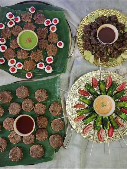 A selection of our vrat friendly Navratri appetizers. We offer a variety of flavorful options like sabudana tikkis and kuttu kebabs, served with fresh chutneys on traditional banana leaves and ornate platters.