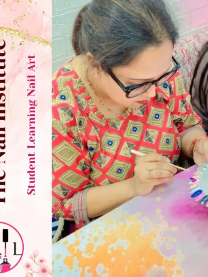 A student practices her brushwork on a color wheel, an essential exercise for improving control and creativity in nail art.