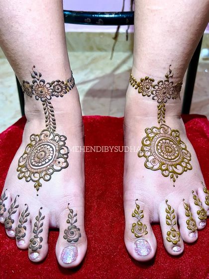 A top-down view of the minimalist mandala foot design.