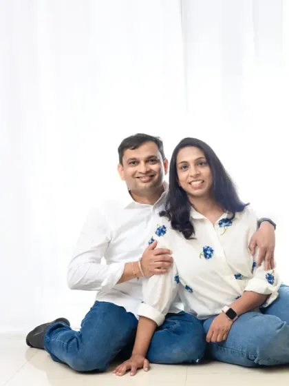 A relaxed couple's portrait in the all-white studio. This clean and bright style is perfect for creating modern and fresh images.