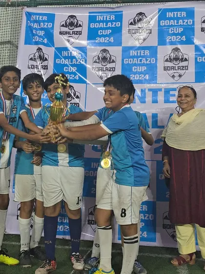 The Under-12 winners celebrating their victory at the Inter Goalazo Cup with their families.