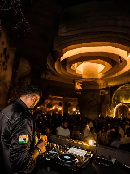 A wide shot from behind the console at Baglami, showing the unique design of the venue and the full dance floor.