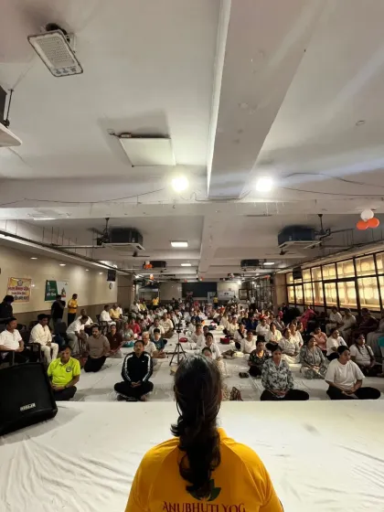 The view from the front of the class, as I lead a large group in meditation during our International Yoga Day celebration. It's an honor to guide so many people on their wellness journey.