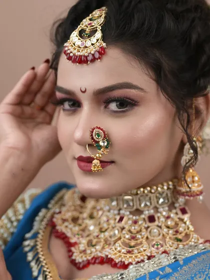 A close-up of the student's makeup work, showing her skill in creating a sharp, defined look.