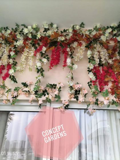 The full view of the floral canopy, demonstrating how it frames the doorway and adds a touch of elegance.
