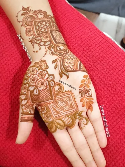 A single-hand view of the Arabic-style design, showing the delicate flow of the pattern from the wrist to the fingers.