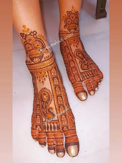 A traditional bridal foot design featuring a large peacock and kalash motifs. The pattern is dense and covers the foot beautifully, perfect for wedding ceremonies.