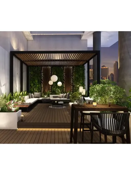 This terrace design creates an intimate evening ambiance with warm, low-level lighting. The space includes a covered seating area with a green wall and an open-air dining spot, perfect for city nights.