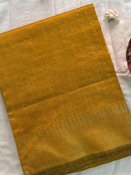 A repeat image of the classic mustard yellow semi raw silk saree.