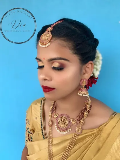 I created this timeless South Indian bridal look for a client's wedding day. It features classic gold-toned eyes, a bold red lip, and a flawless base that lasts through all the ceremonies. This is the kind of detailed bridal artistry you will master in my pro course.