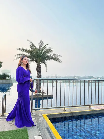 A serene moment by the pool in Agra, wearing a stunning purple saree. Even during a busy work trip, I find moments to appreciate the beauty around me.