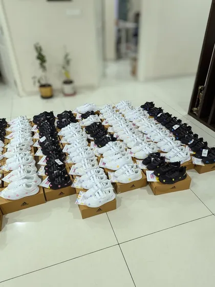 The calm before the storm. All 70 pairs of Adidas sneakers, ready to be customized. It was a huge undertaking, but I had help from my family.