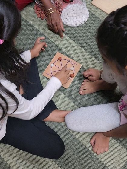 A glimpse into our traditional Indian games workshop. Here, children are learning a strategic board game, which requires logical thinking, keen observation, and fine motor skills.